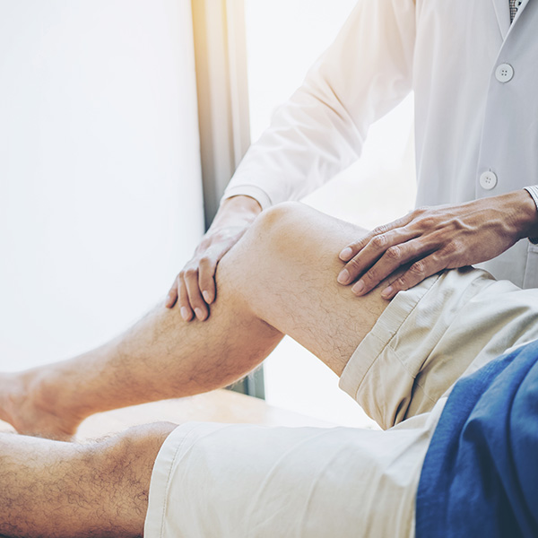 Physical Doctor consulting with patient Knee problems Physical therapy concept