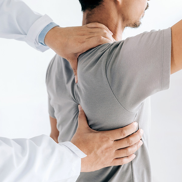 A doctor provides shoulder focused physical therapy to a patient in Plano and Fort Worth, TX